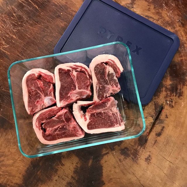 A glass container with fresh meat from the Butcher's Block in Wānaka.