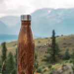 A water bottle by the mountains.